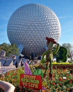 A topiary of Woody from "Toy Story" guards Spaceship Earth during Epcot's Flower and Garden Festival, March 2011.